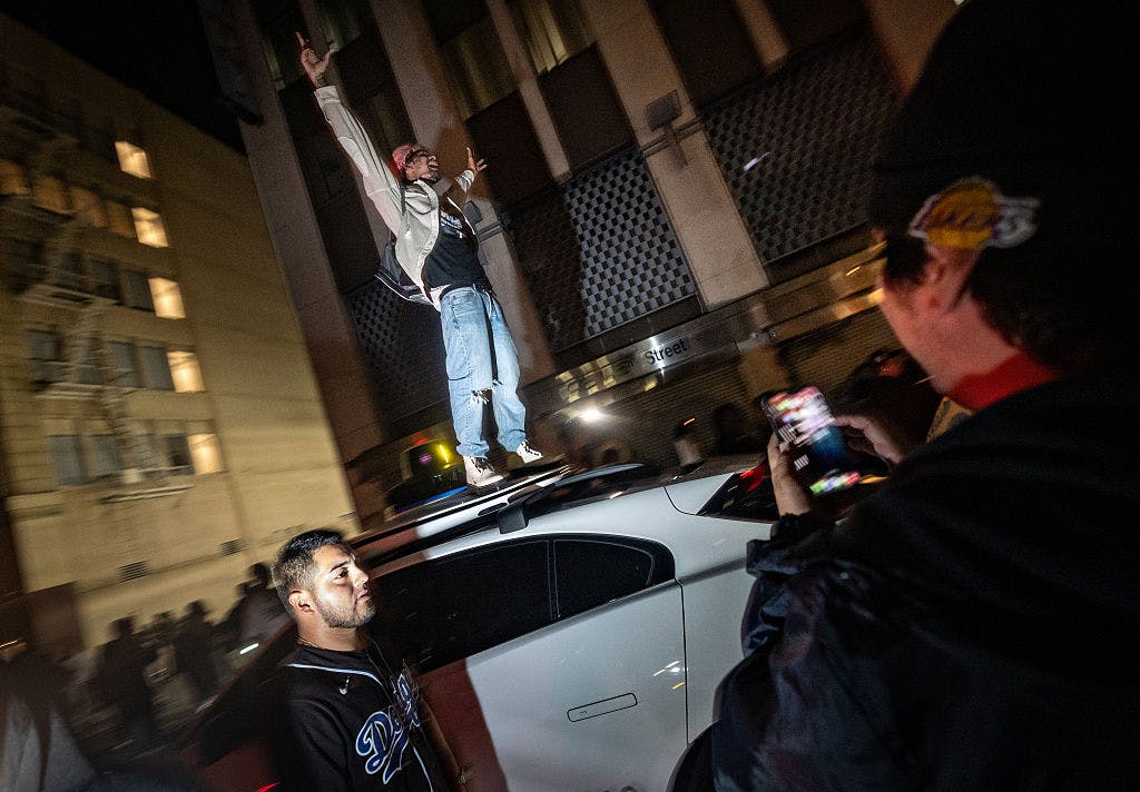 Los Angeles Dodgers fans celebrate in downtown Los Angeles as their team clinches another World Series title