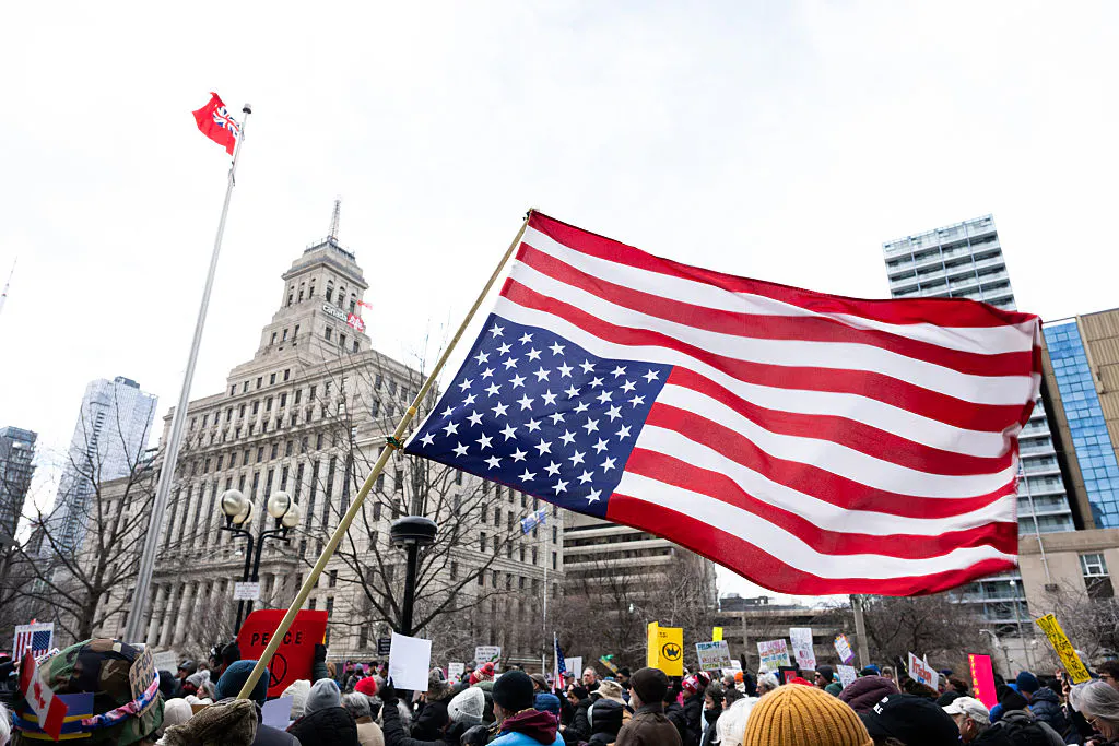 A protester waves the upside down U.S. flag during the