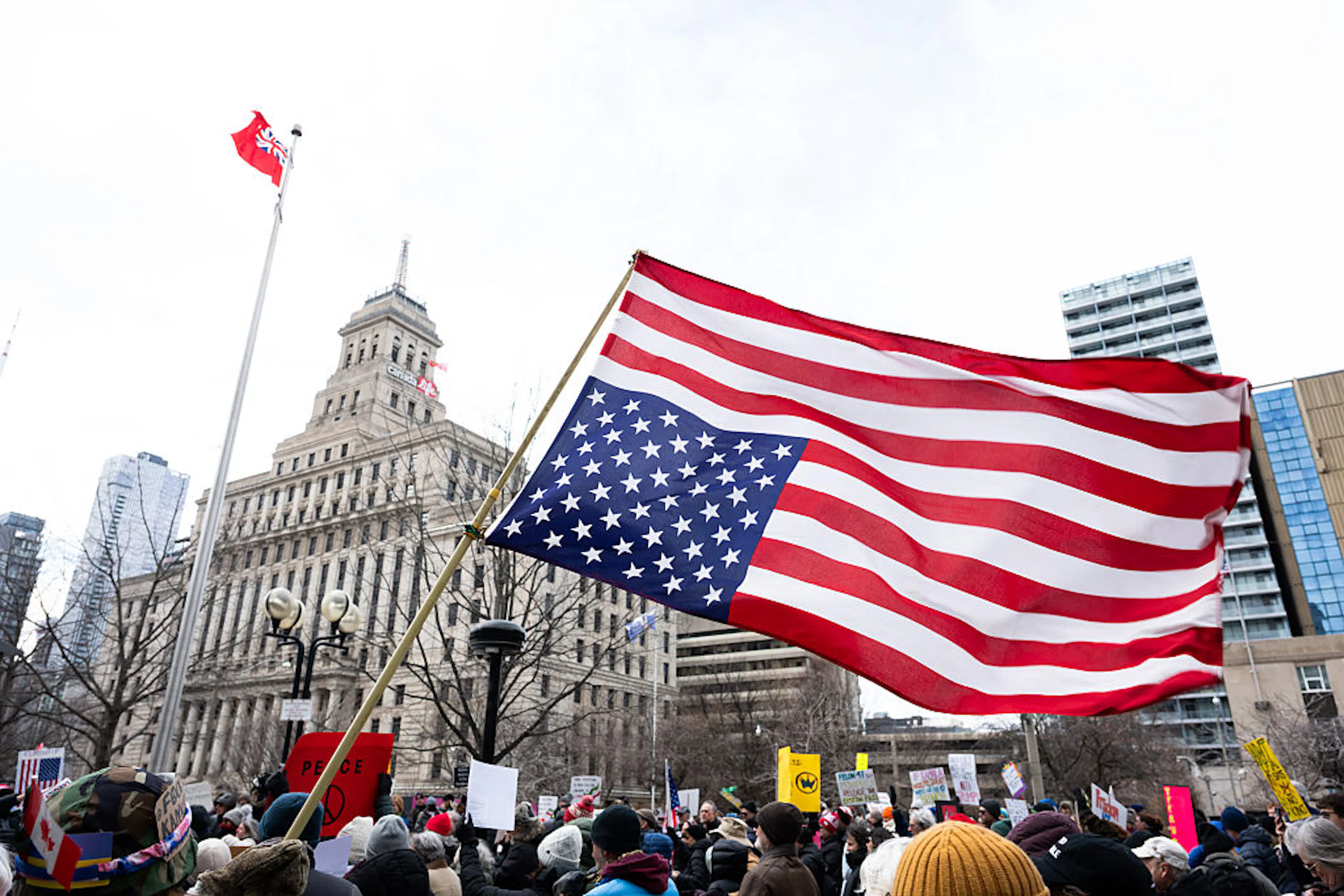A protester waves the upside down U.S. flag during the