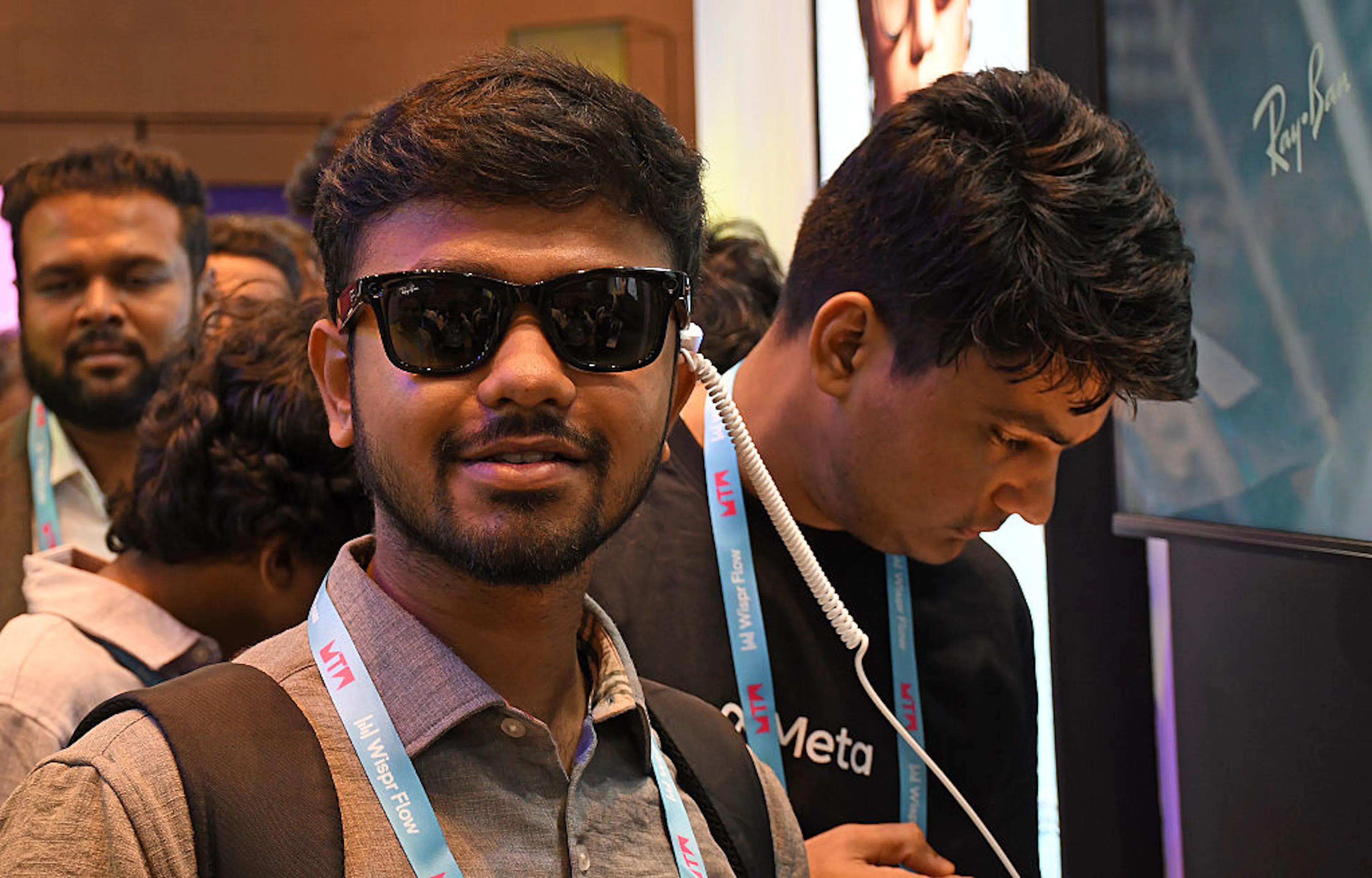 A visitor is seen trying a Ray-Ban Meta glasses at a Meta