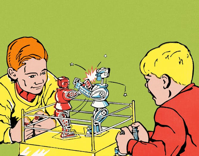Boys Playing with Boxing Robots