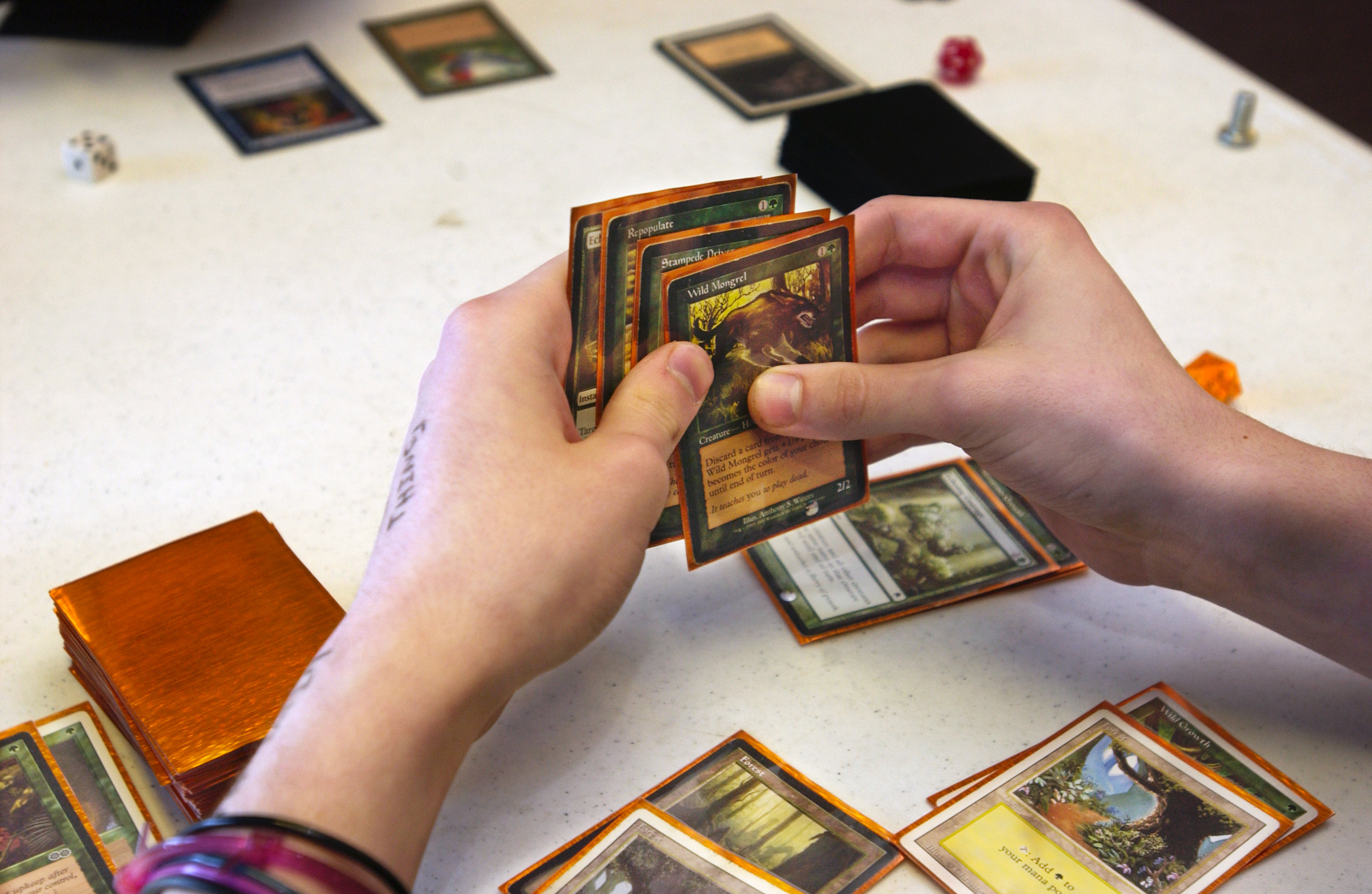 Brent Krott, 15, holds a hand of cards in a game called Magic the Gathering At Crossroad Games in St...