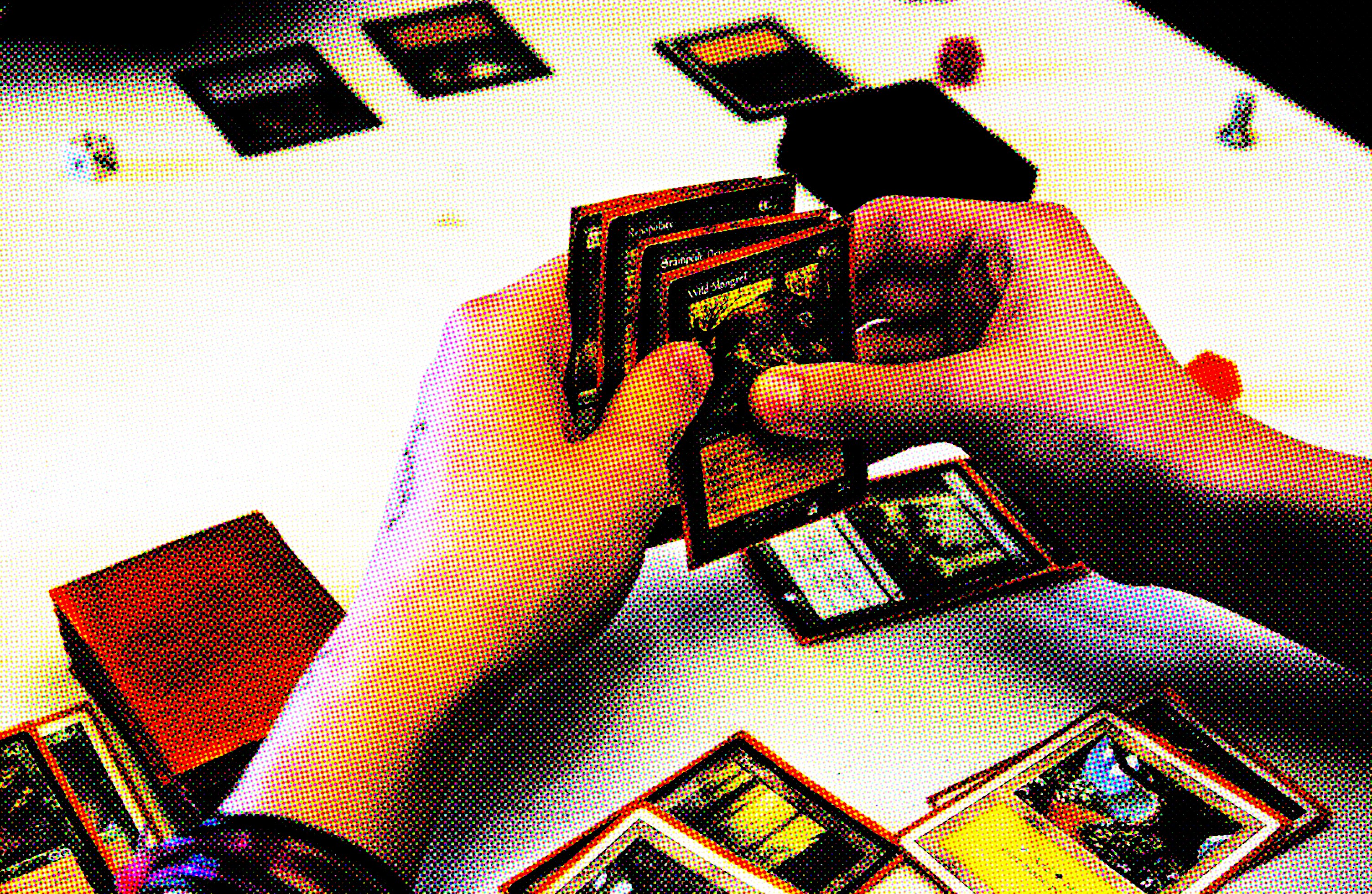 Brent Krott, 15, holds a hand of cards in a game called Magic the Gathering At Crossroad Games in St...