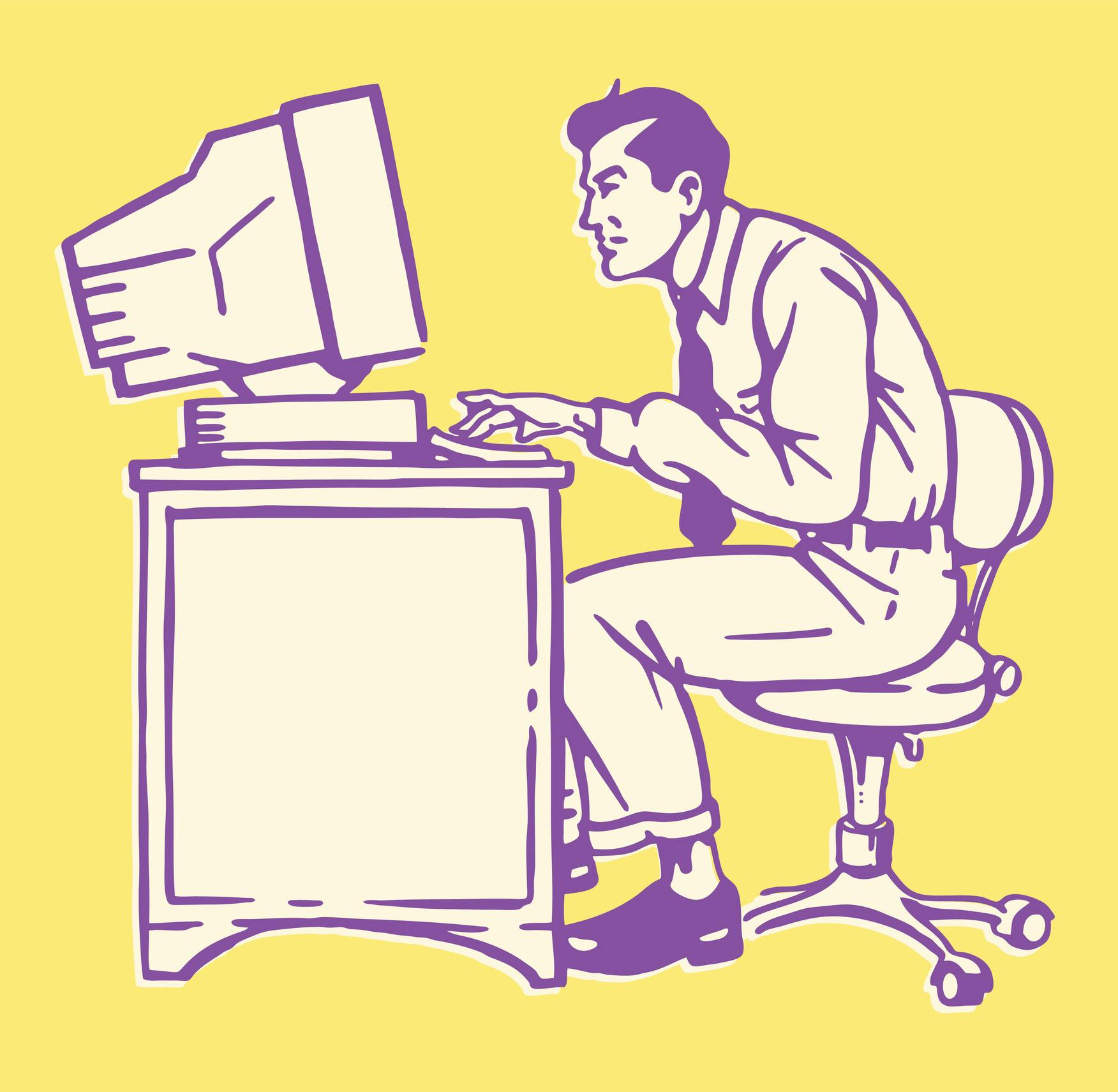 Man at Desk Working on Computer