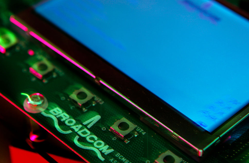 The Broadcom logo is stamped on a circuit board on a development kit u