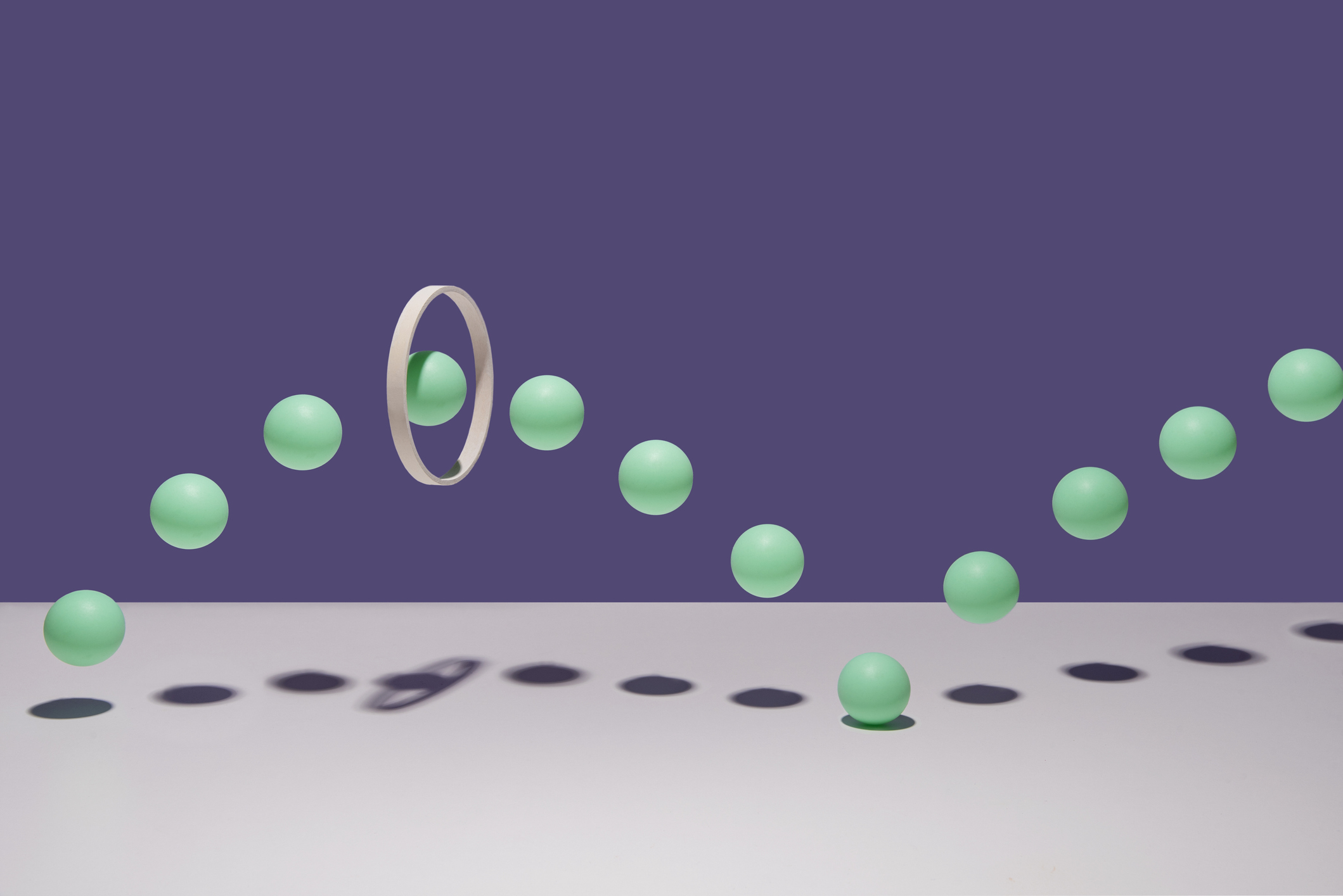 Many balls going through a hoop