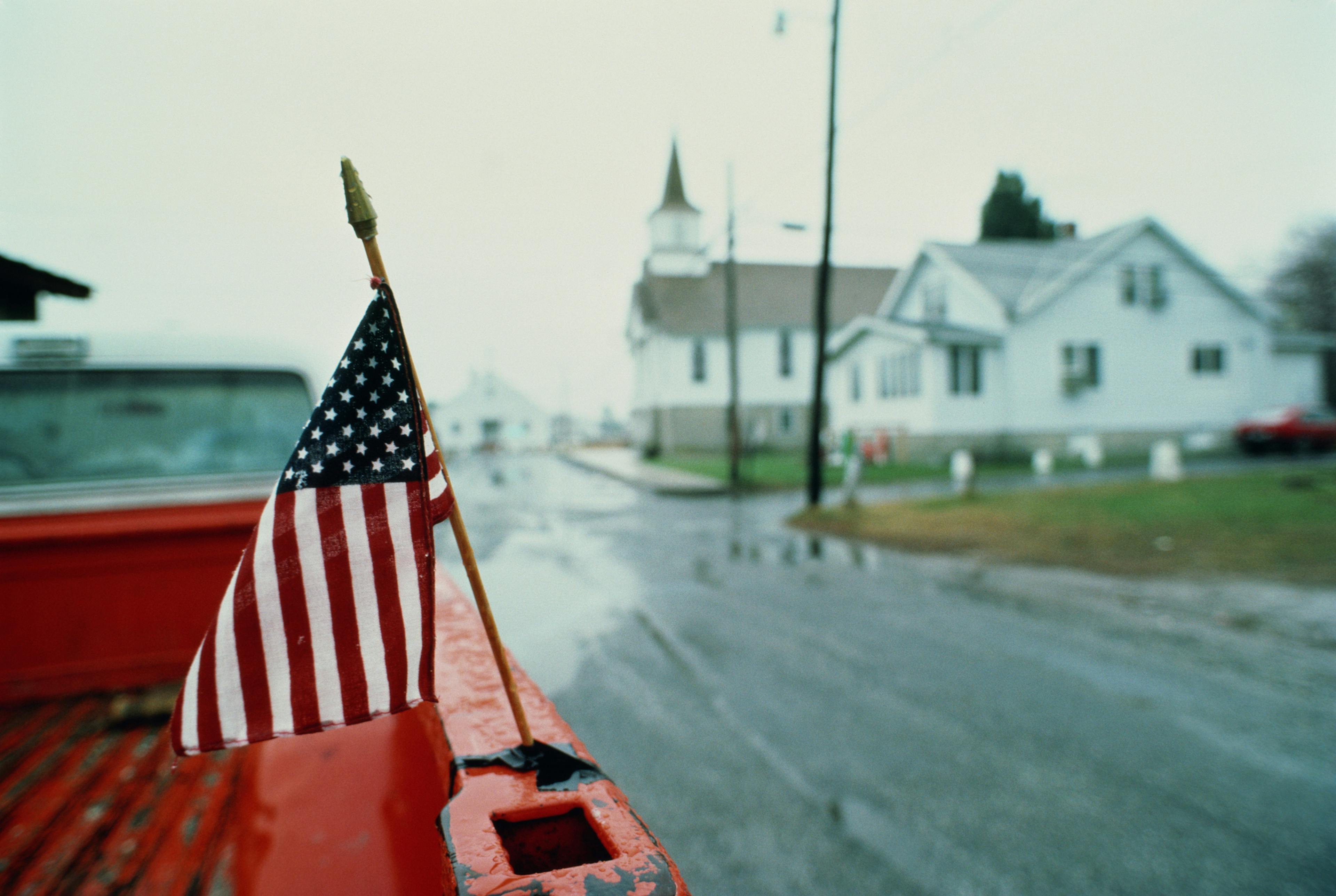 Stars and Stripes on back of pickup truck, USA