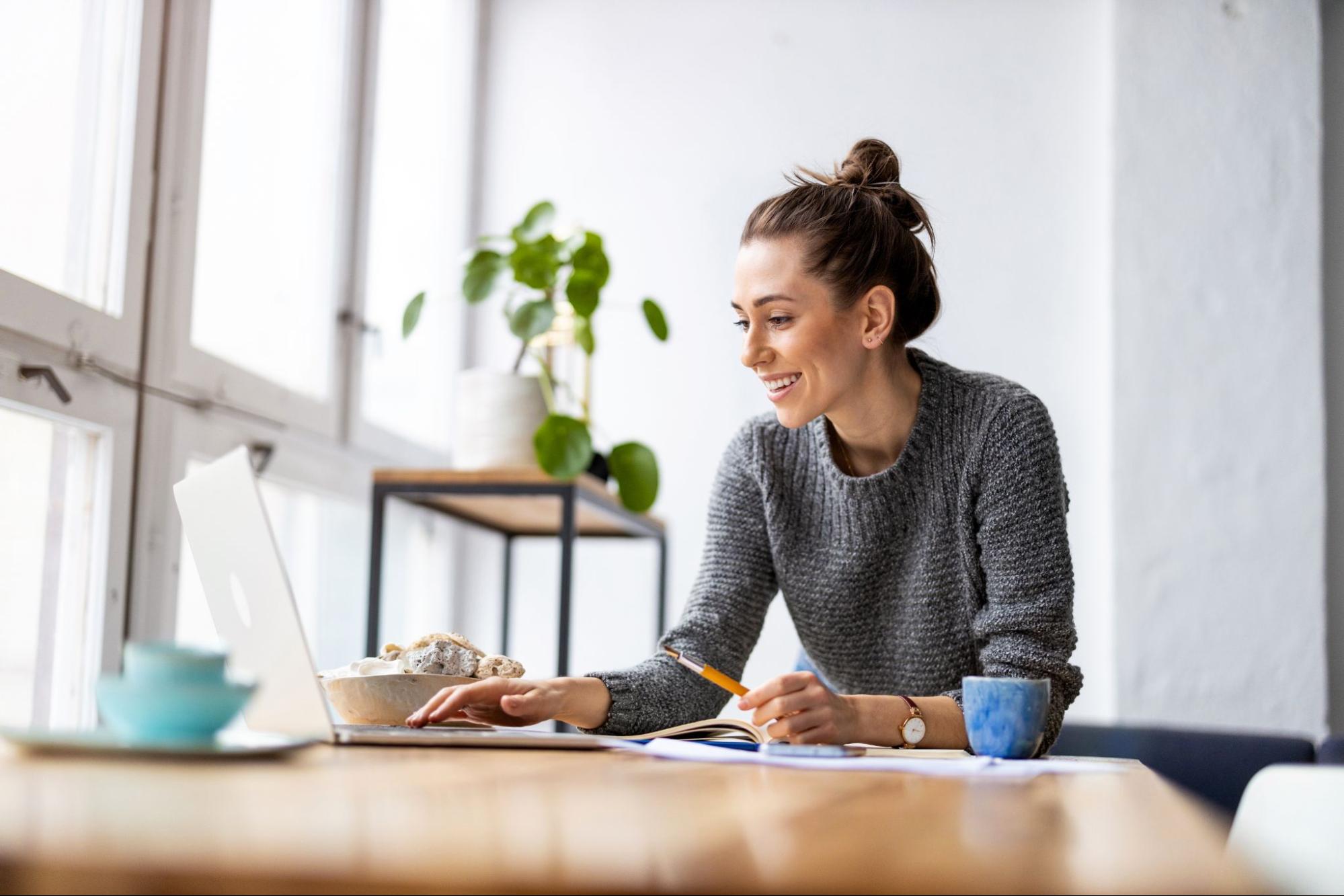 Woman looking at laptop